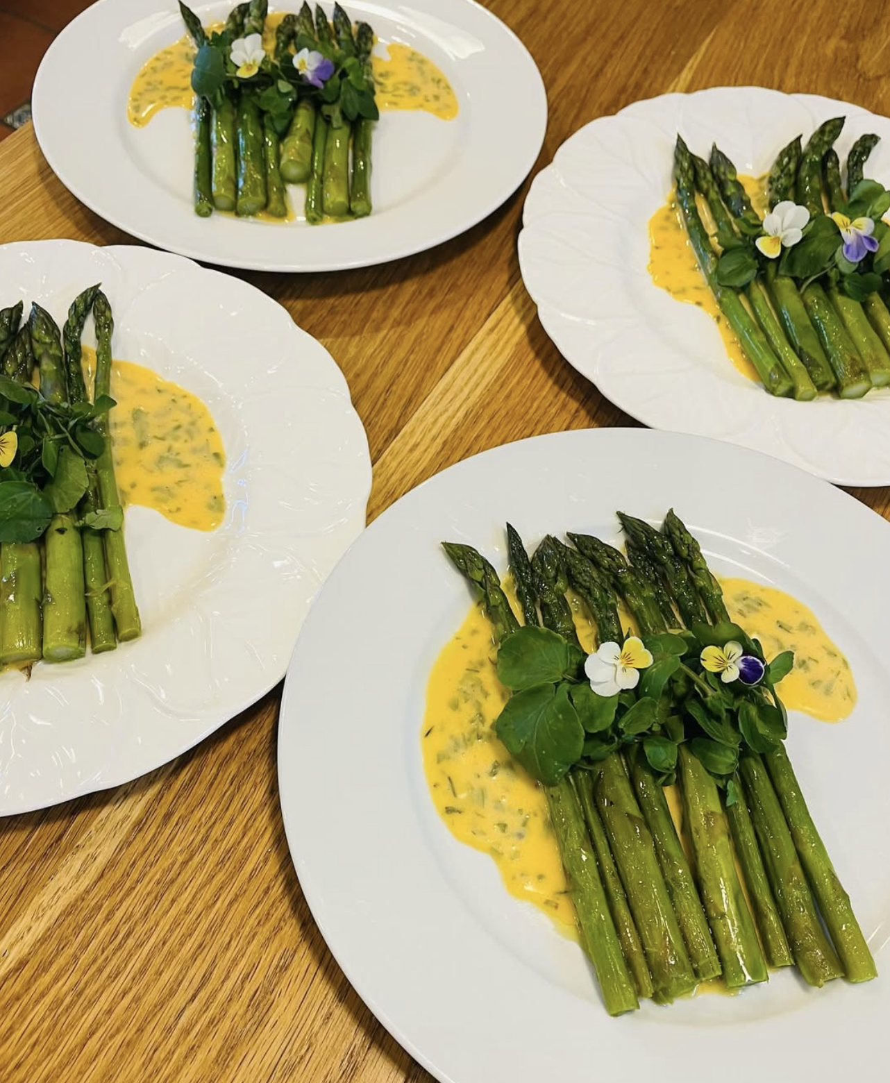 Asparagus with hollandaise and edible flowers