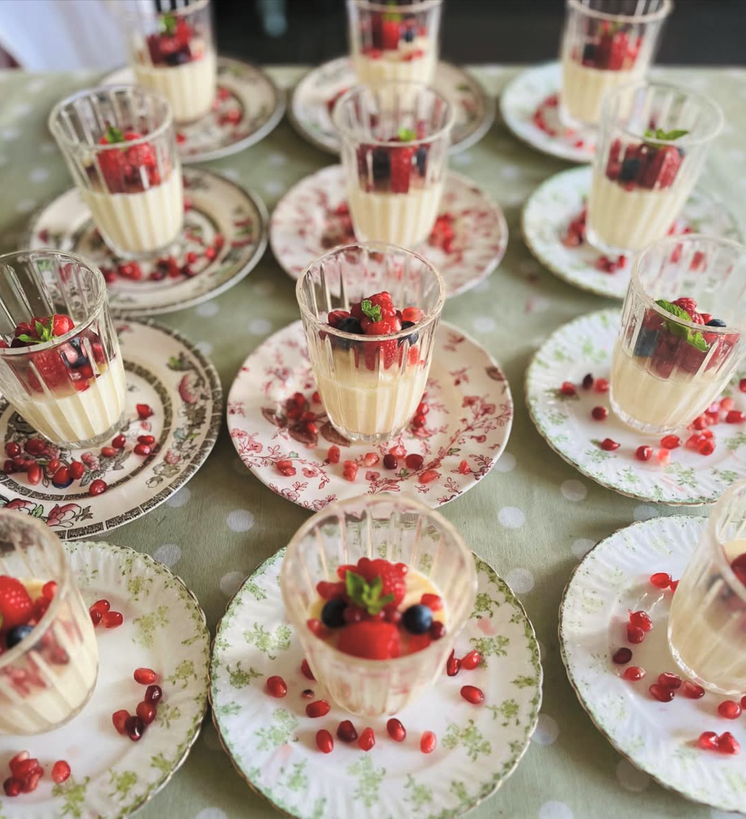 Panna cotta on vintage china with pomegranate