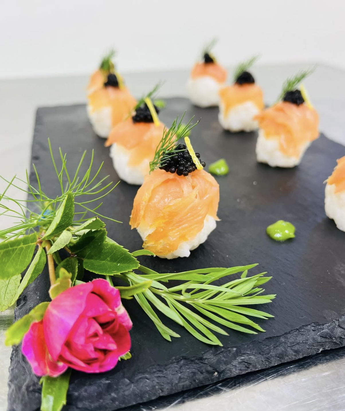 Smoked salmon and caviar canapés on slate