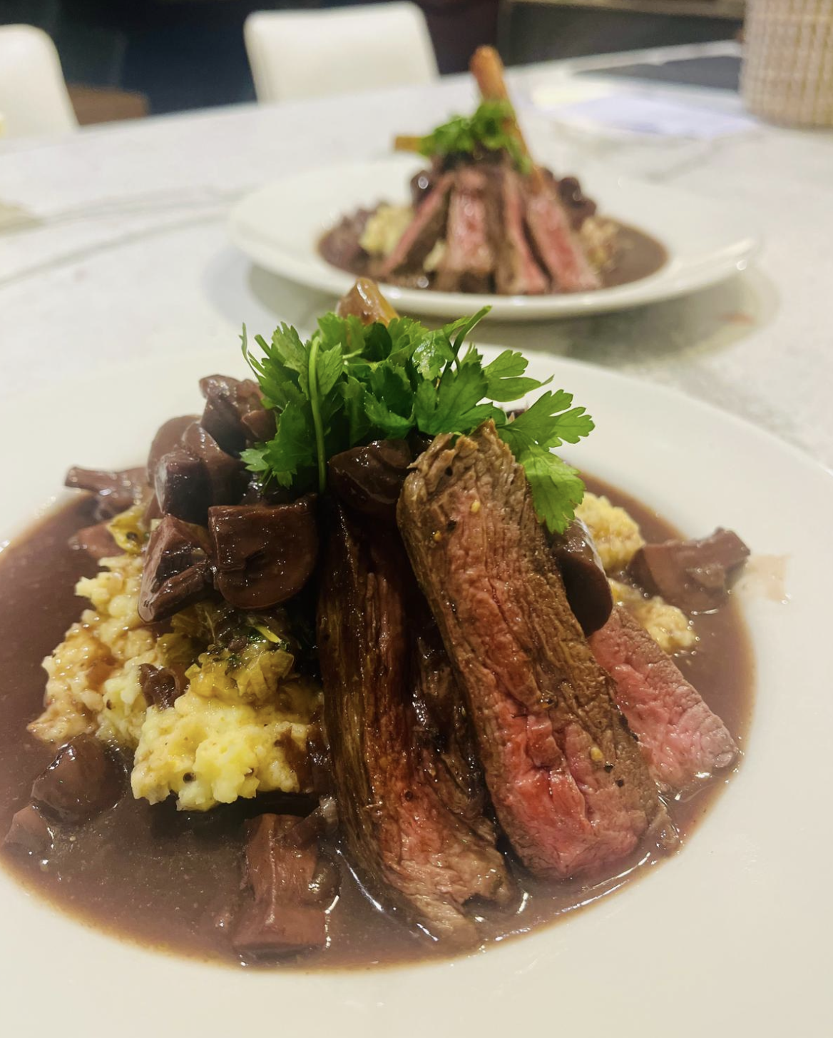 Seared steak with polenta and wild mushroom jus
